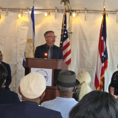 CSS' Keith Stahl stands at a podium making remarks at the ceremony.